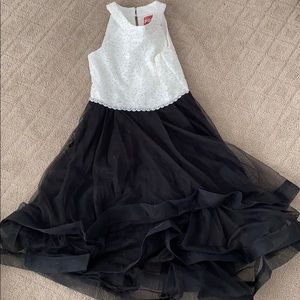 A ruffel black and white dress with gems